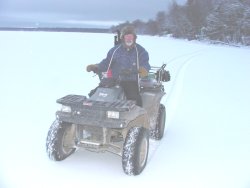 image of ice fishermen on ATV