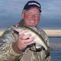 image of angler with eating size walleye
