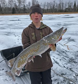 image of ice fisherman with big pike