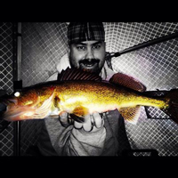 image of Jeremy Taschuk holding walleye