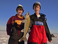 image of Nate Thelen holding Walleye on Ice