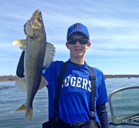 image of Nate Thelen holding Walleye from Lake MilleLacs