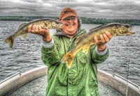 image of Rich Riemersma holding two big Walleyes