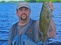 image of Brian Castellano holding nice Smallmouth Bass