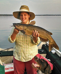 image of Kally Powell holding catfish caught in Lake Mendota 