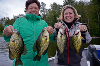 image of Kendra Olson and friend holding large Crappies