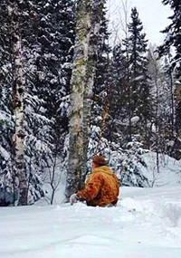 image of man walking in waist deep snow