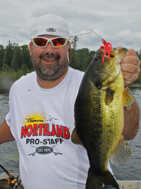 image of Jeremy Taschuk holding largemouth Bass