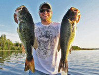 image of Brett McComas holding Giant Bass