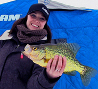 image of Amanda holding big Crappie on the ice