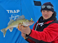 image of Reed Ylitalo holding Walleye