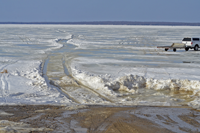 image of roadway heading onto Bowstring lake