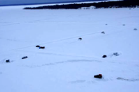 aerial view of Lake Winnibigosh ice conditions shows trucks on the ice