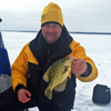image of Jon Thelen with Crappie on ice