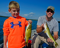 image of Barry and Owen Cheatham holding fish