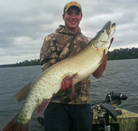 image of Chester Powell holding big Musky