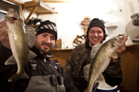 image of nik dimich and justin holding walleyes on Lake Winnie