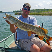 image of Austin Jones with big Northern Pike