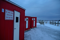 image of ice fishing shelters on the ice
