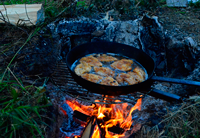 image of Bluegills cooking on fire