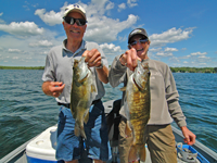 image of Jim and Jan Bopp with a pair of nice Smallmouth Bass