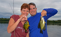 image of Tammi and Chase Norton with crappie and sunfish