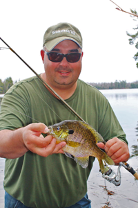 image of Tom Batuick holding nice bluegill