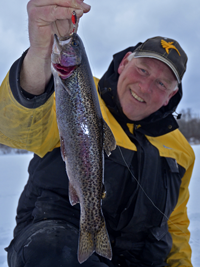image of Jeff Sundin holding Rainbow Trout on ice