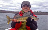 image of Gail Heig Bowen Lodge holding Walleye on Cutfoot Sioux