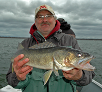 image of Tim Fischbach holding Leech Lake Walleye