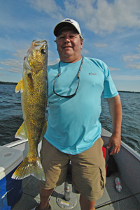 image of Larry Horseman holding nice Walleye