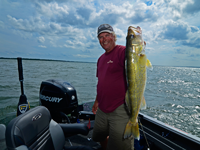 image of fishing guide jeff skelly with a Leech Lake Walleye