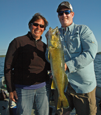 Image of Glenn Fraze holding a monster Walleye