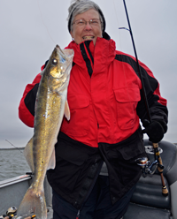 image 2 of Penny Becker with bigger Leech Lake Walleye