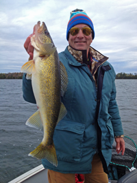 image of Tim Higgins with big Walleye