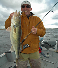 image of Tim Vaughn with large Walleye