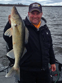 image of Jon Thelen holding big walleye links to fishing aRTICLE