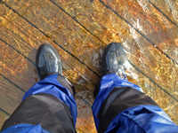 image of water standing over the deck of boat dock