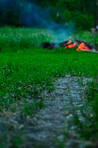 image of fire burning in the rain