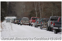 image of ice fishermen lined up at landing