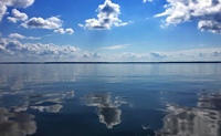 image of mirror smooth bowstring lake