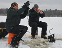 image of Chris and Jeff reeling in crappie