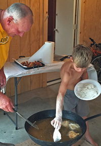 image of Owen Cheatham frying fish