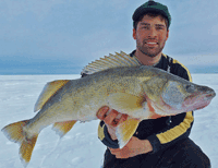 image of Mike Walsh holding monster Lake Winnipeg Walleye