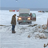 image of men stranded on the wrong isde of a pressure ridge on Splithand Lake