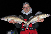 image of Dr. Jason Halfen holding Walleyes