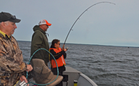 image of Eric and Esa Goettl landing fish