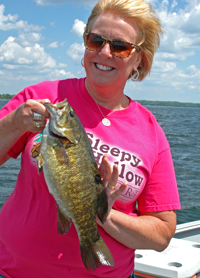 image of Mari Petersen with big Smallmouth