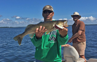 image of fisherman holding Walleye on Winnie