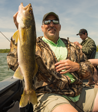 image of Phil Goettl holding a big Leech Lake Walleye